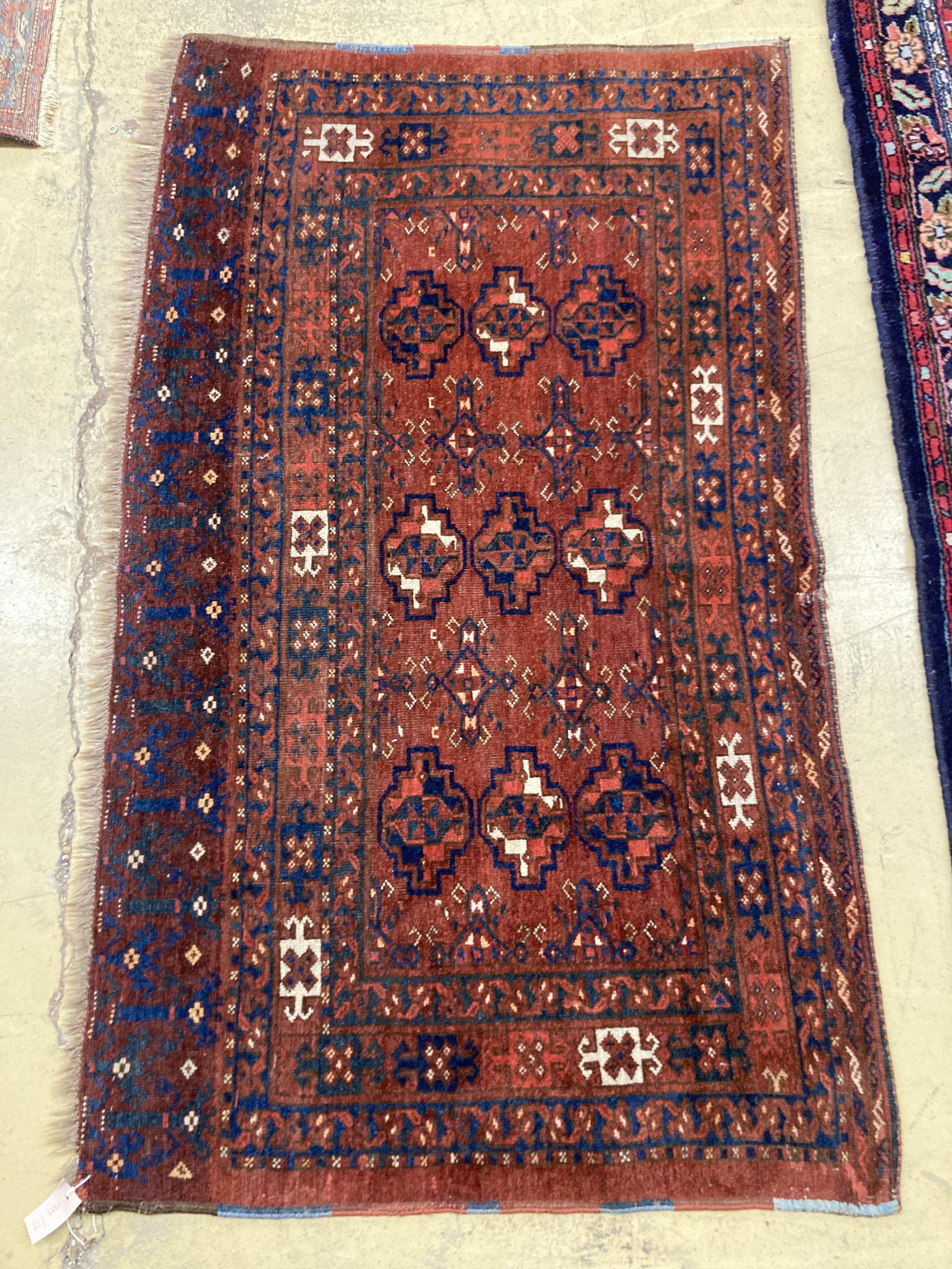 An antique Tekke burgundy ground rug, 150 x 92cm